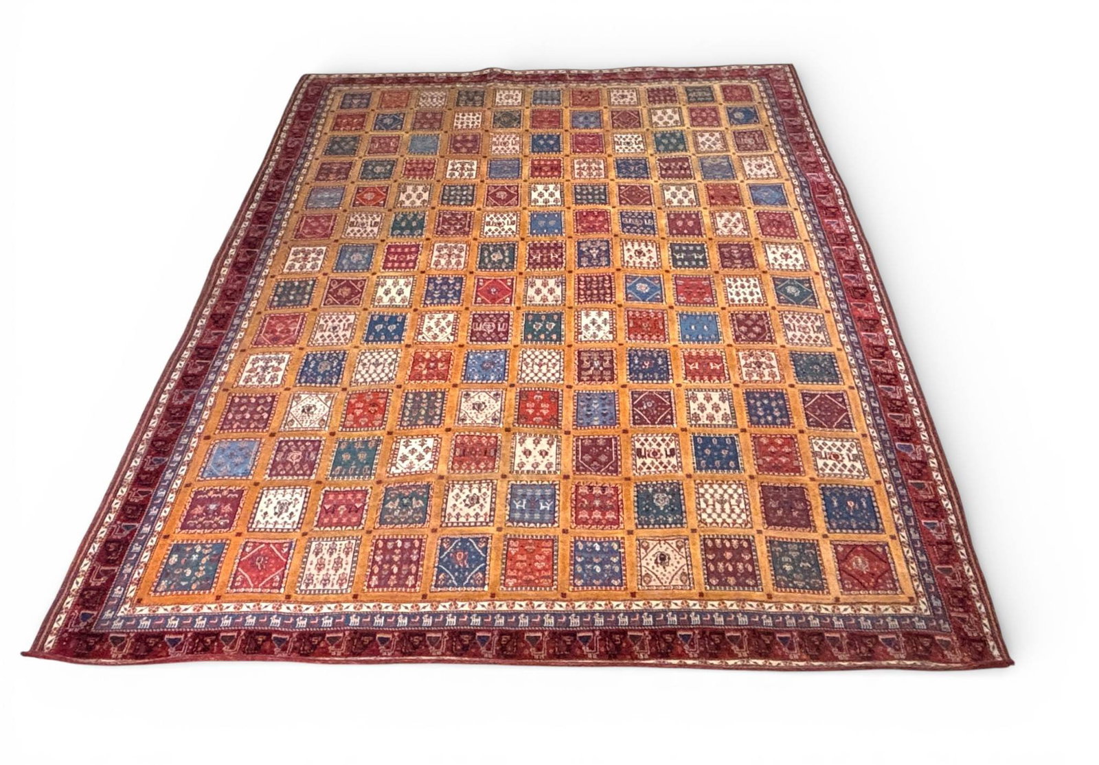 Handwoven Persian Qashqai Wool Rug with Khesti Layout 9.5 x 9: Handwoven Iranian Persian Qashquai tribal rug, featuring a classic khesti layout composed of multicolored square compartments filled with stylized floral and geometric motifs. Woven in wool pile knott
