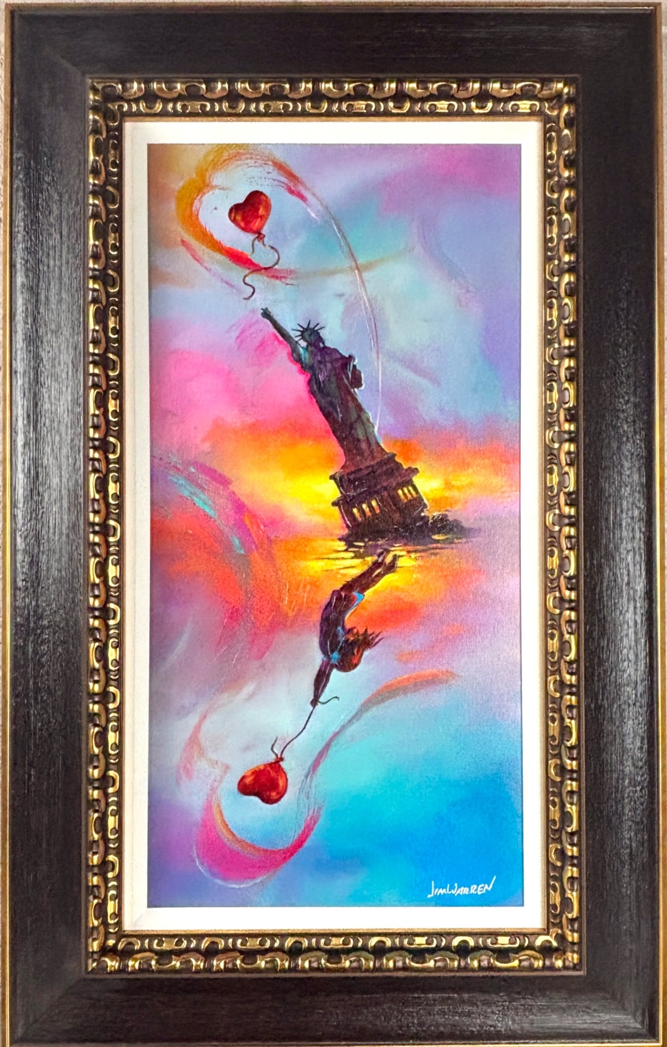 Jim Warren. The New Spirit Of Love and Liberty. Framed Giclee: Giclee artwork titled The New Spirit Of Love + Liberty by Jim Warren, produced in 2021. Features vibrant imagery of the Statue of Liberty, a heart shaped balloon, and rich, colorful skies. Hand signed