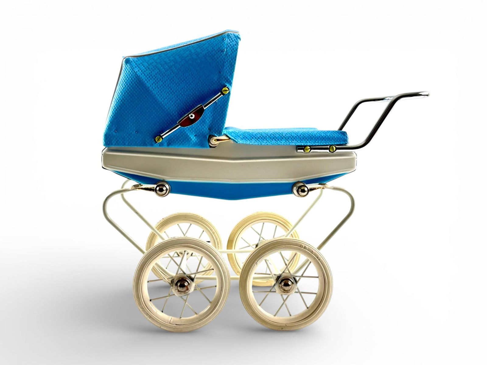 Doucet Baby Carriage with Original Box, Made in France: A Doucet brand baby carriage toy featuring a metal frame with four white spoked wheels. The carriage body has a white and blue finish with a textured blue vinyl canopy. The handle is chrome-toned meta