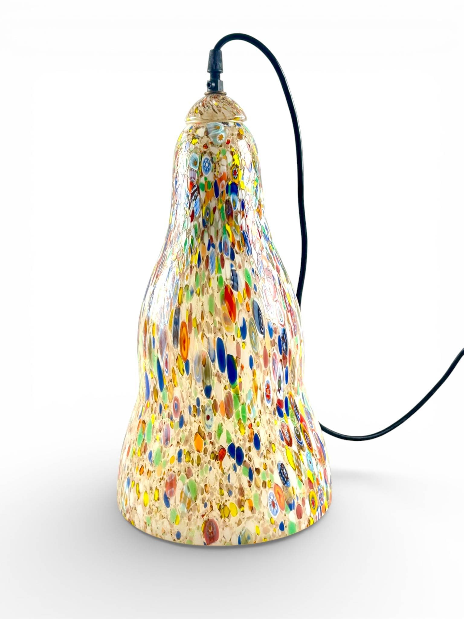 Murano Style Multicolor Millefiori Glass Pendant Light: Murano style glass pendant light with a hand blown design featuring a millefiori pattern of multicolored dots, ovals, and motifs. The bell shaped glass shade displays a textured, flowing form,
