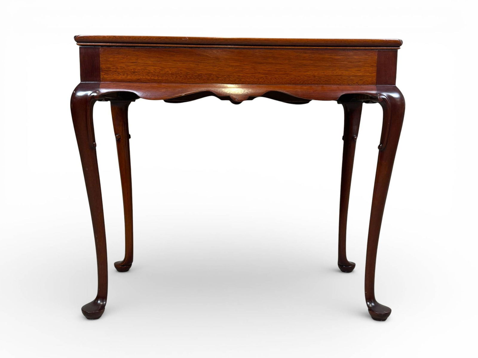 Mahogany Side Table with Cabriole Legs and Extending Side Panels: Mahogany side table featuring a rectangular top with a raised lip and beveled corners. The table includes cabriole legs terminating in pad feet, a central drawer with brass knob, and two extending