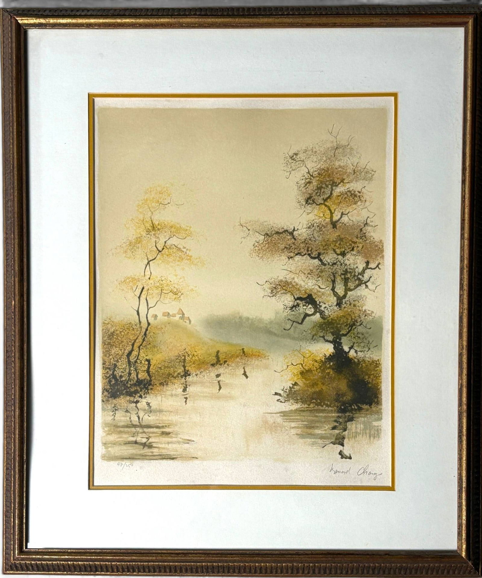 Bernard Charoy Brook in the Country Lithograph With COA: Color lithograph by Bernard Charoy depicting a serene waterside landscape with leafy trees and distant cottages. Signed in the lower right corner and marked as number 97 of 450 in an edition. Framed