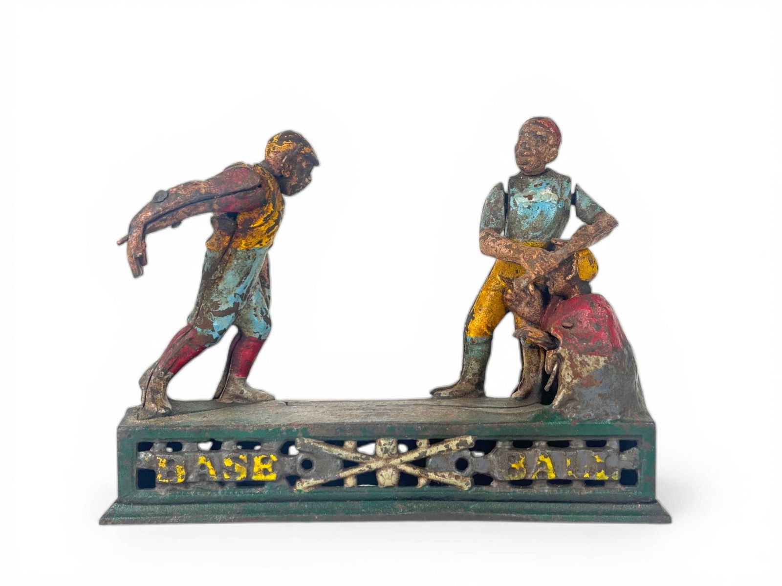 Darktown Battery Cast Iron Mechanical Bank: Cast iron mechanical bank known as Darktown Battery, featuring a baseball motif. Depicts three figures, including a pitcher, catcher, and batter, with brightly colored remnants of original paint. The