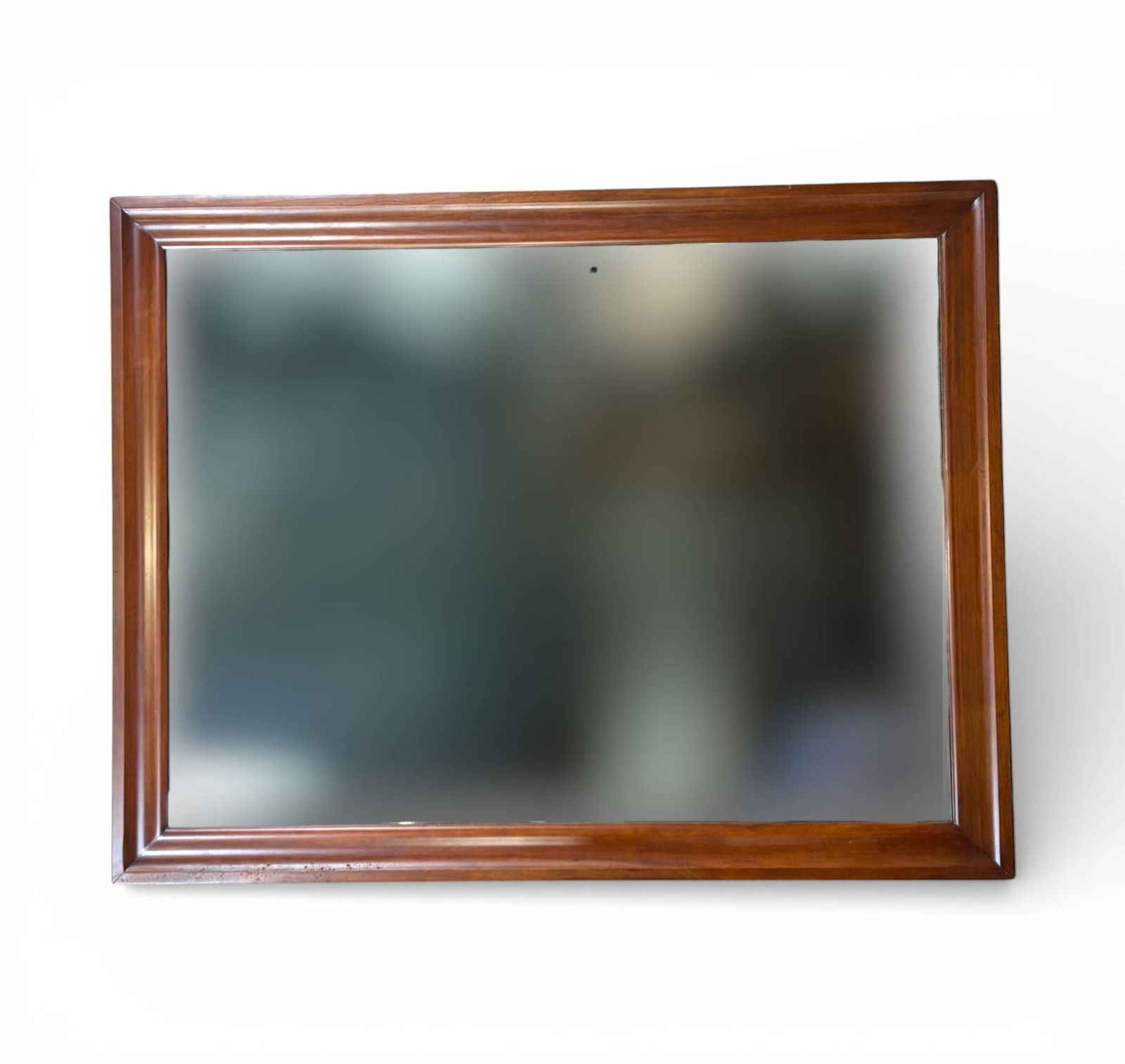 Henkel Harris Rectangular Wood Framed Mirror: Rectangular mirror by Henkel Harris featuring a wooden frame with a molded edge design. Makers mark and inspection label present on the reverse. Frame displays a polished finish in excellent