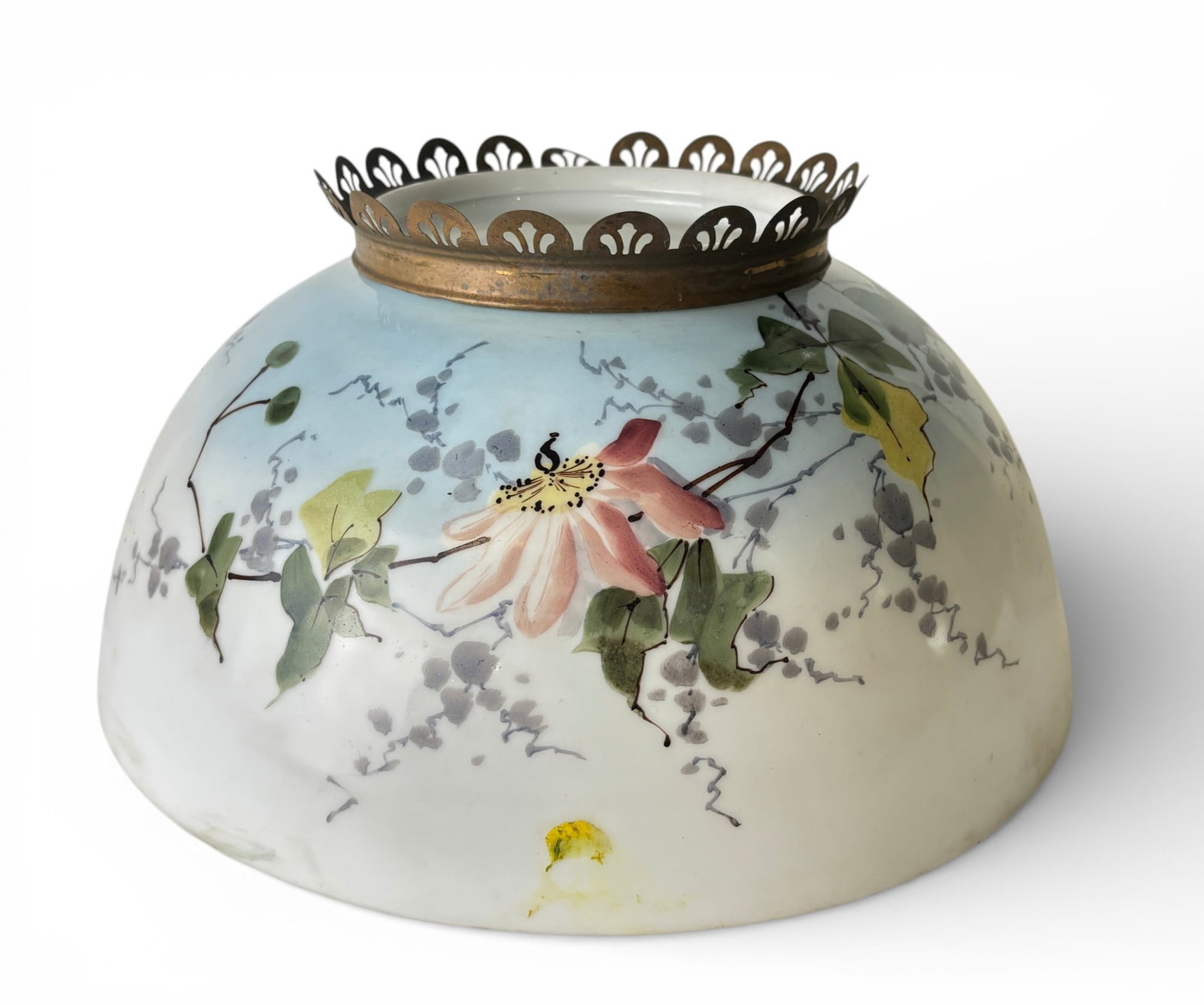 Hand Painted Glass Light Shade with Brass Fitter Ring: Glass light shade featuring a floral hand painted design with pink, yellow, and green accents on a gradient blue to white background. The piece has a brass crown style fitter ring with decorative pier