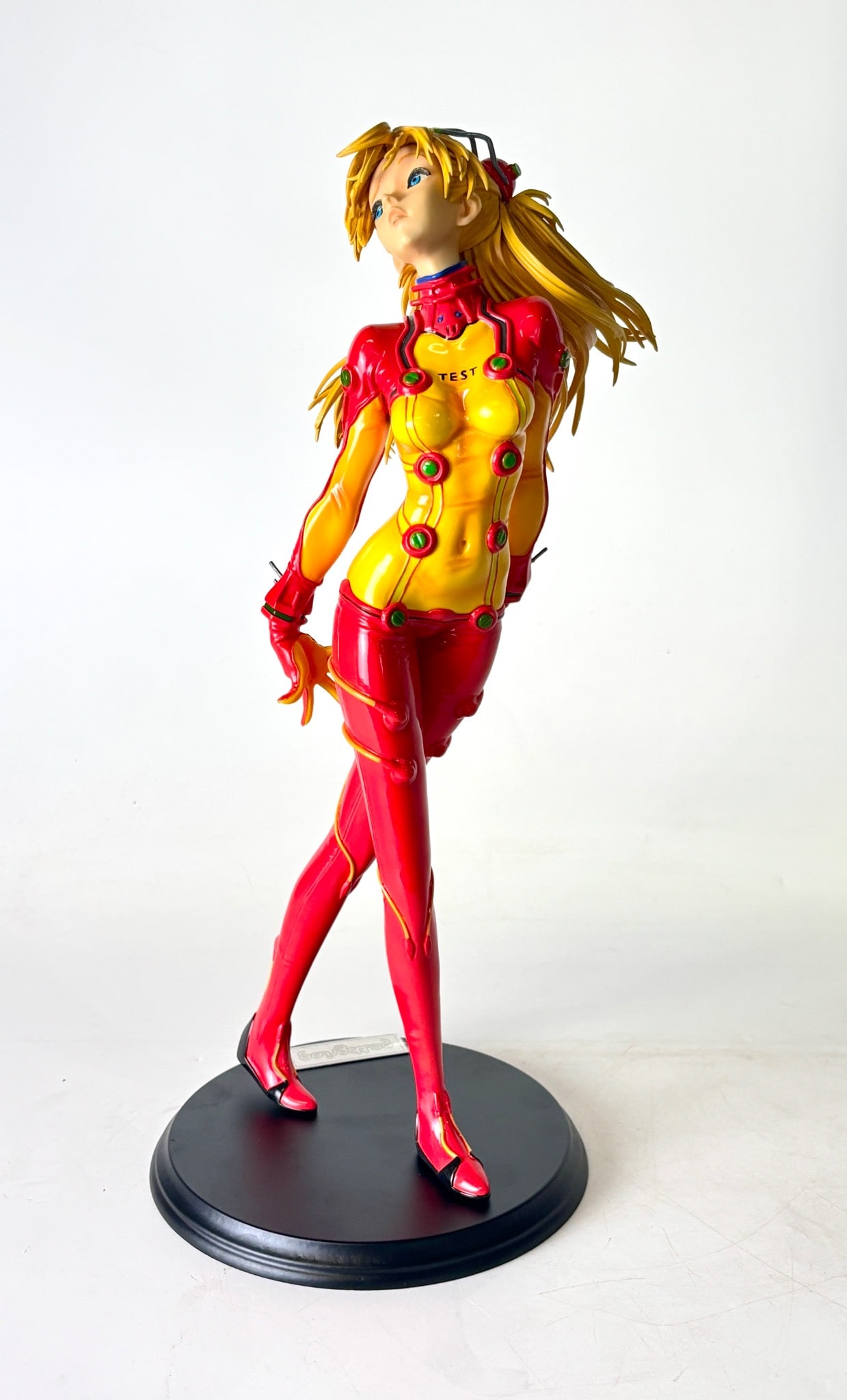 PF7138 Shikinami Asuka Langley Gathering E2046: Shikinami Asuka Langley collectible figure in a red and yellow plugsuit with dynamic hair design, manufactured by E2046. Model PF7138, pre painted and mounted on a black display base with a metal plat