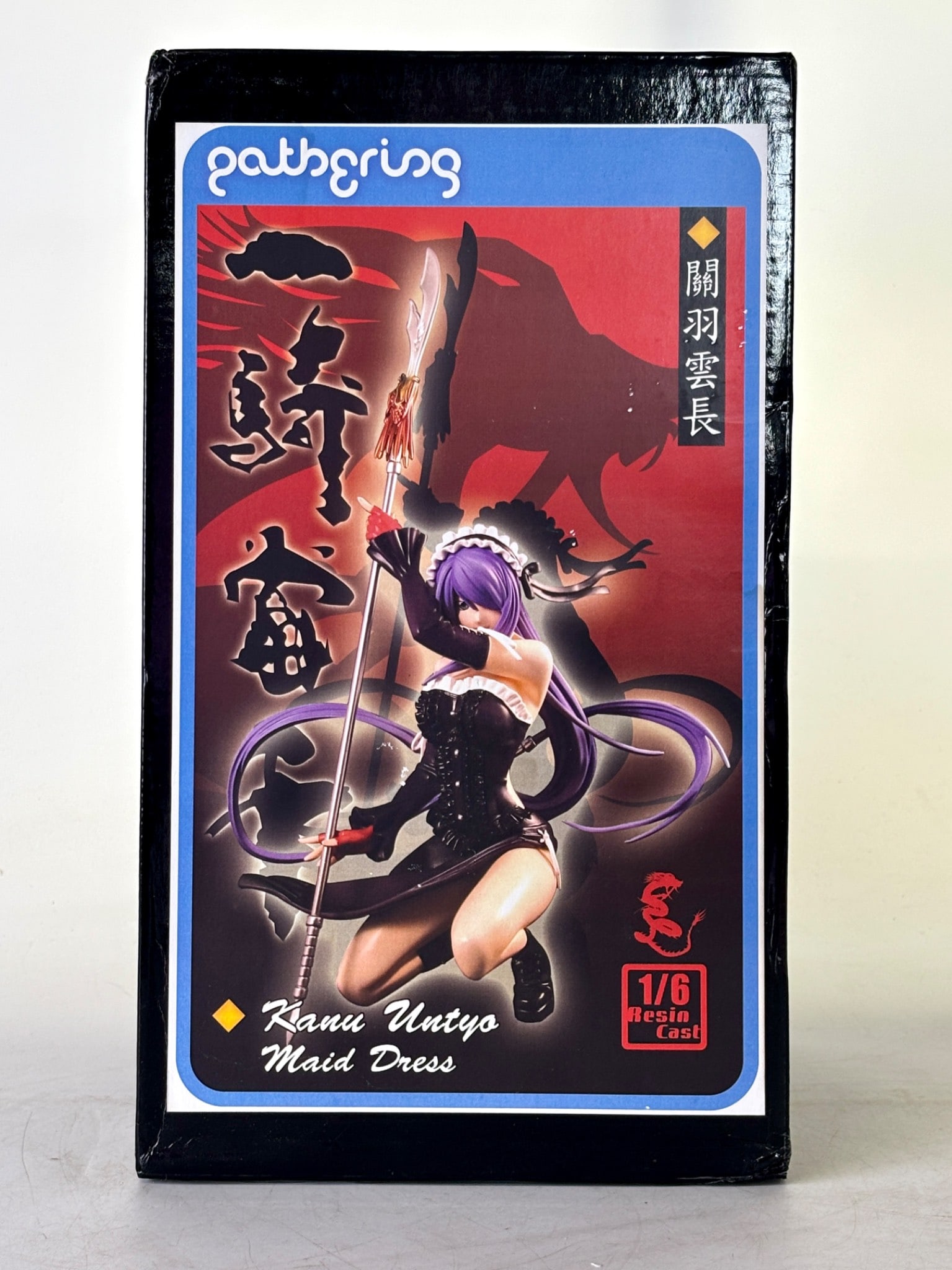 Gathering 1/6 Scale Kanu Untyo Maid Dress Resin Figure: Gathering 1/6 scale resin cast figure titled Kanu Untyo Maid Dress. The packaging features an image of the figure with vibrant colors and Japanese text. Figure depicted with detailed attire and purple