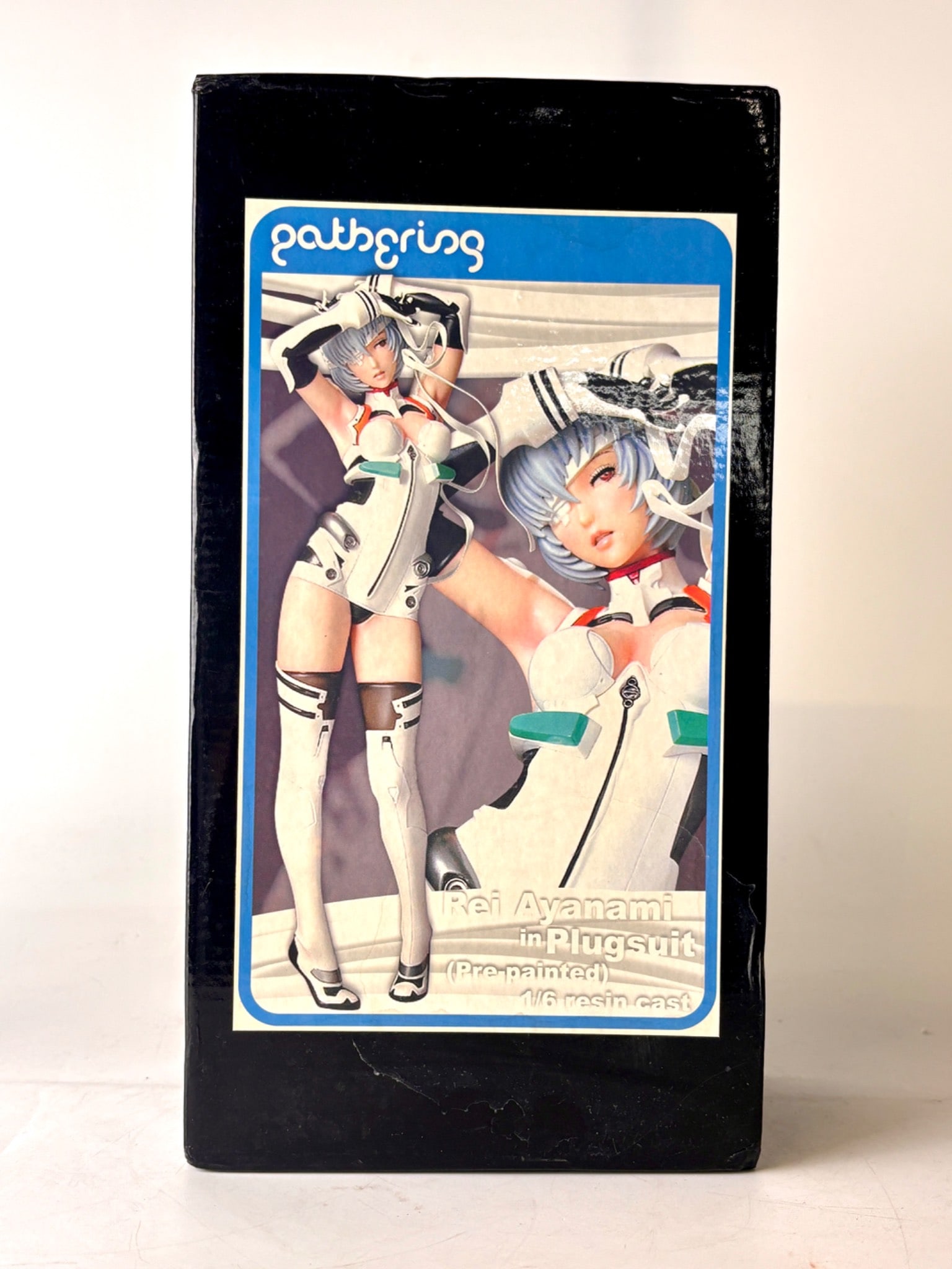 1/6 Scale Rei Ayanami in Plugsuit by Gathering: A 1/6 scale resin figure of Rei Ayanami in a detailed plugsuit, pre painted and manufactured by Gathering. Includes original packaging with foam interior for protection. The figure depicts Rei in a dy