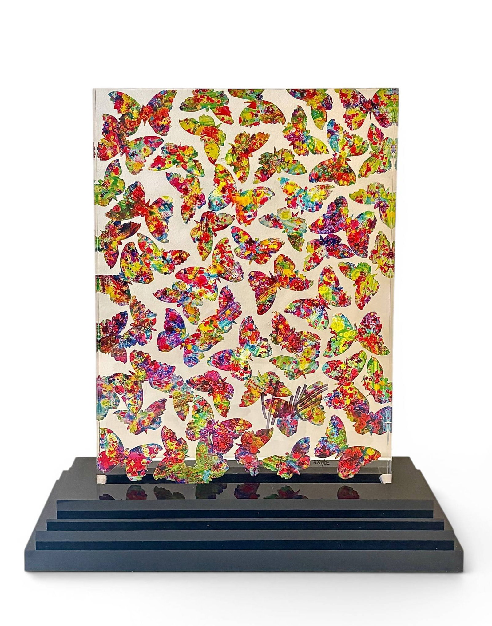 Tim Yank Peta Louthias Sculptograph: Tim Yanke-designed Peta Louthias sculptograph featuring vibrant multicolored butterfly motifs within a clear sculptural surface. Mounted on a black, tiered base, the artwork combines abstract and natu