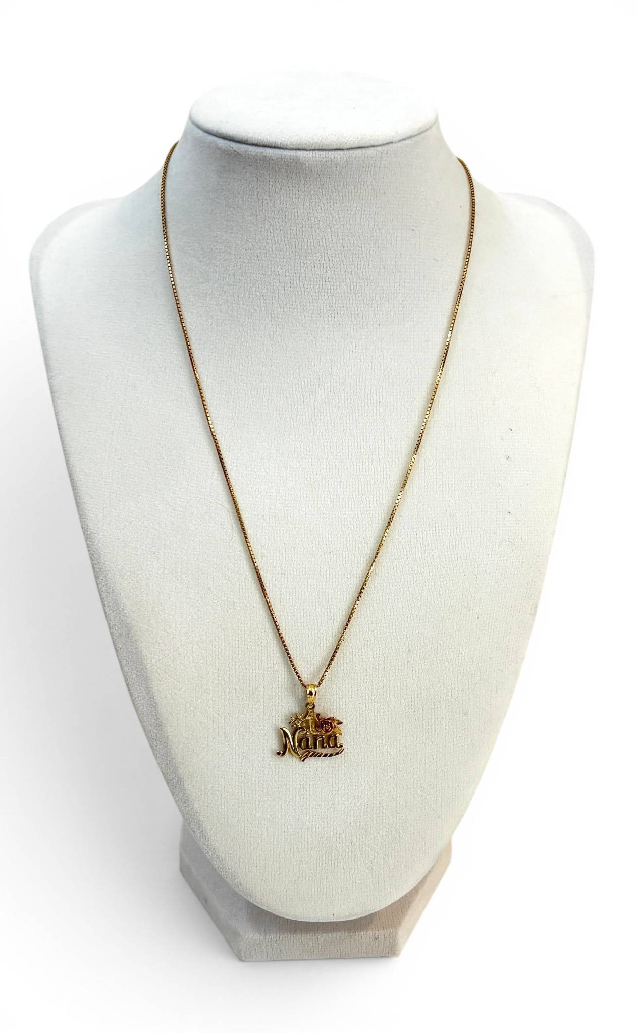 14K #1 Nana Pendant with Chain and Rose Detail: 14K pendant featuring #1 Nana text with an integrated rose detail in contrasting tones. Pendant is suspended on a matching box chain secured by a spring-ring clasp. Condition exhibits light wear consi