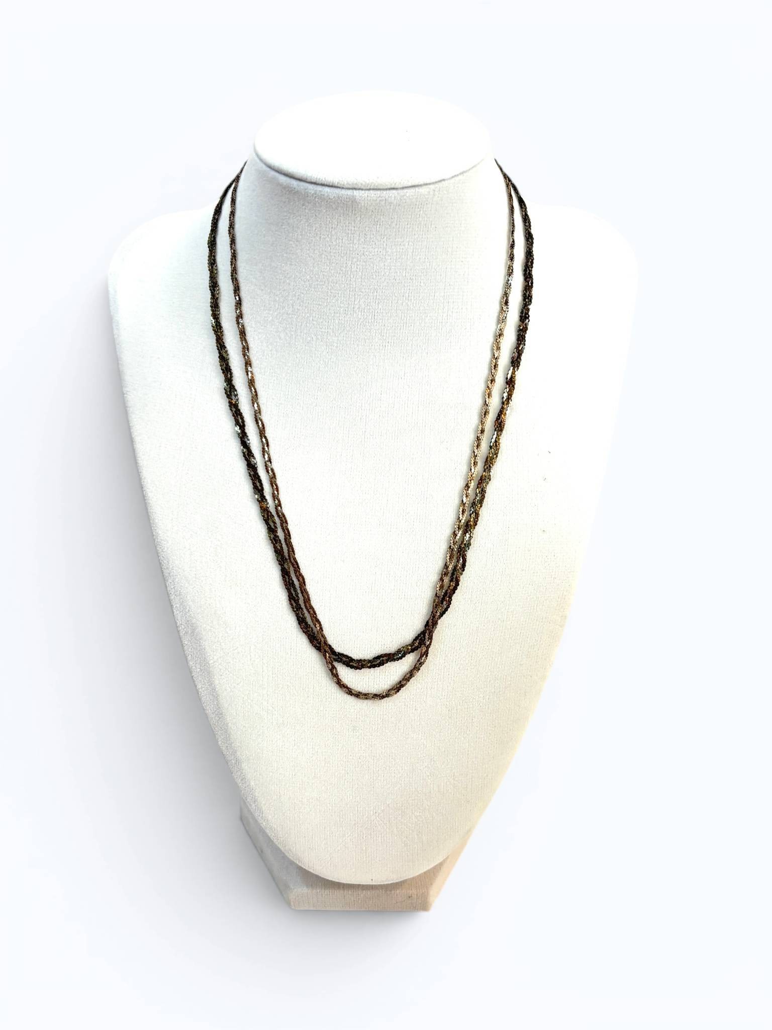 Pair of Sterling Silver Braided Chains: Twisted rope chain necklace in sterling silver, featuring a dual-tone polished finish. The necklace is designed with interwoven links creating a textured appearance and secured with a lobster clasp. H
