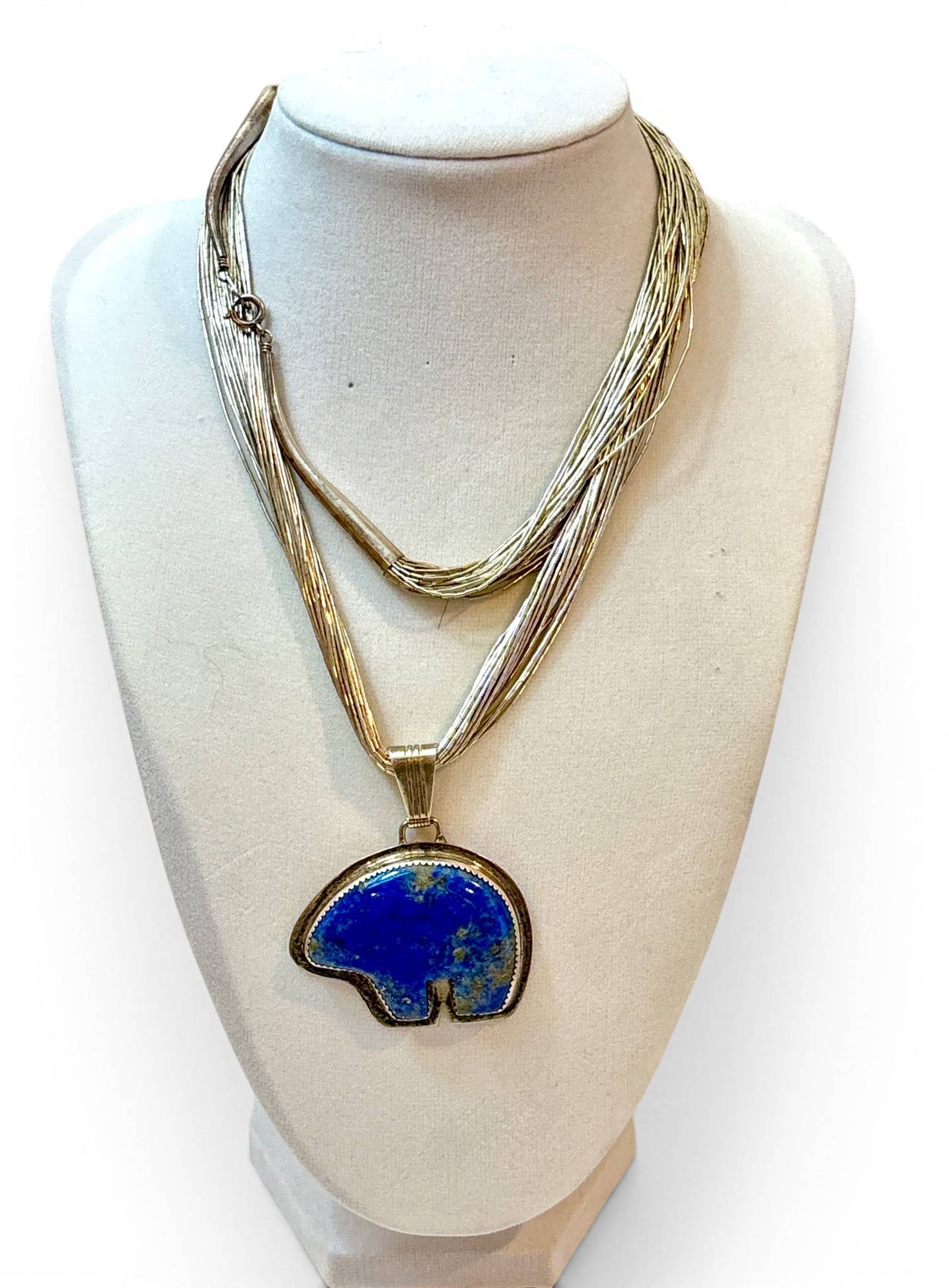 Sterling Silver Multi-Strand Necklace with Lapis Bear Pendant: Sterling silver multi-strand necklace featuring a stylized bear-shaped pendant inlaid with a vibrant lapis lazuli stone. The pendant bale and clasp are marked LTB 925 confirming sterling silver compos