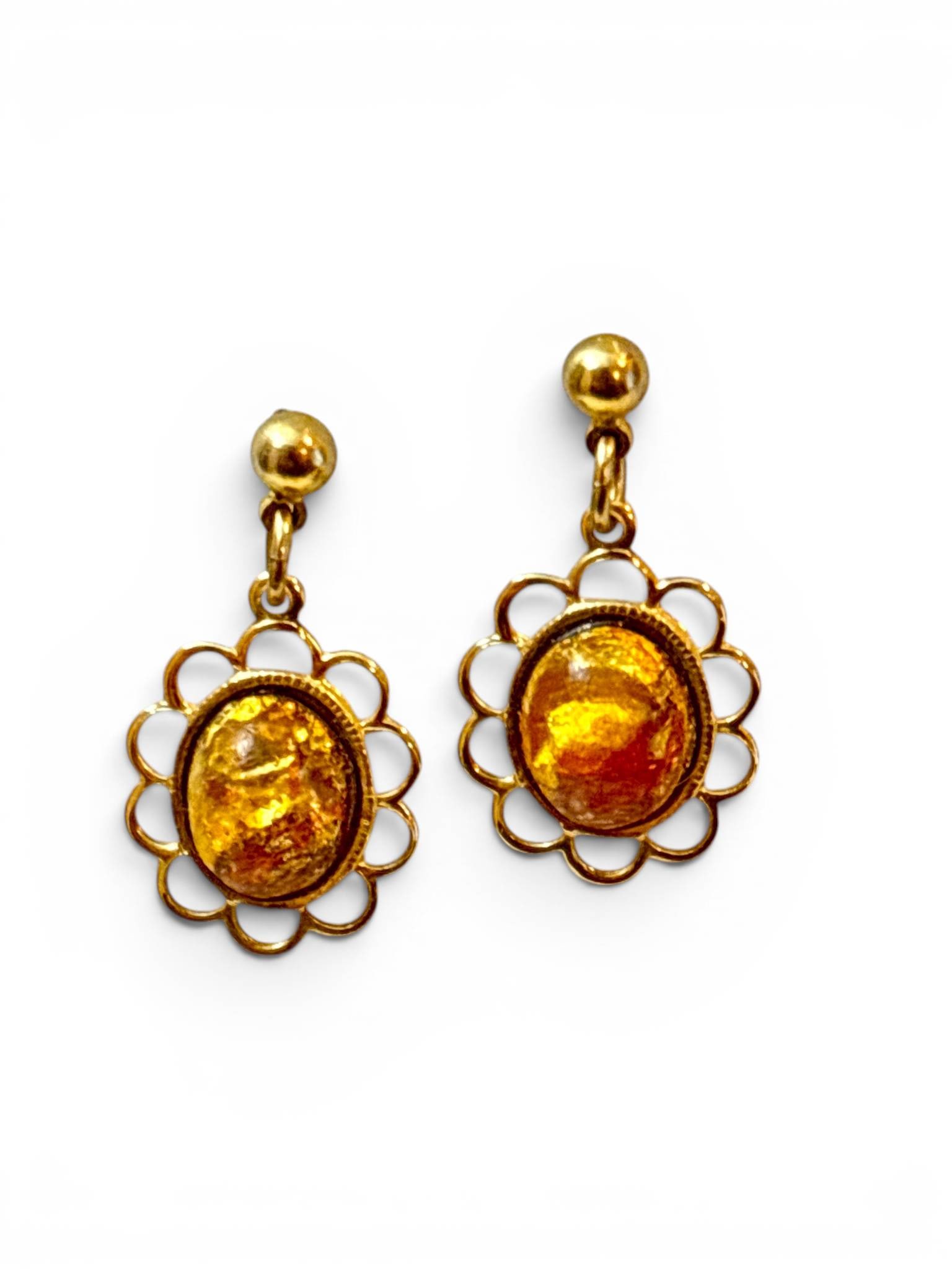 Drop Earrings with Faux Amber Cabochons: Drop earrings featuring oval faux amber cabochons set within gold-tone metal floral frames. Each earring has a post and ball stud fastening design. The faux amber displays a marbled texture with golde
