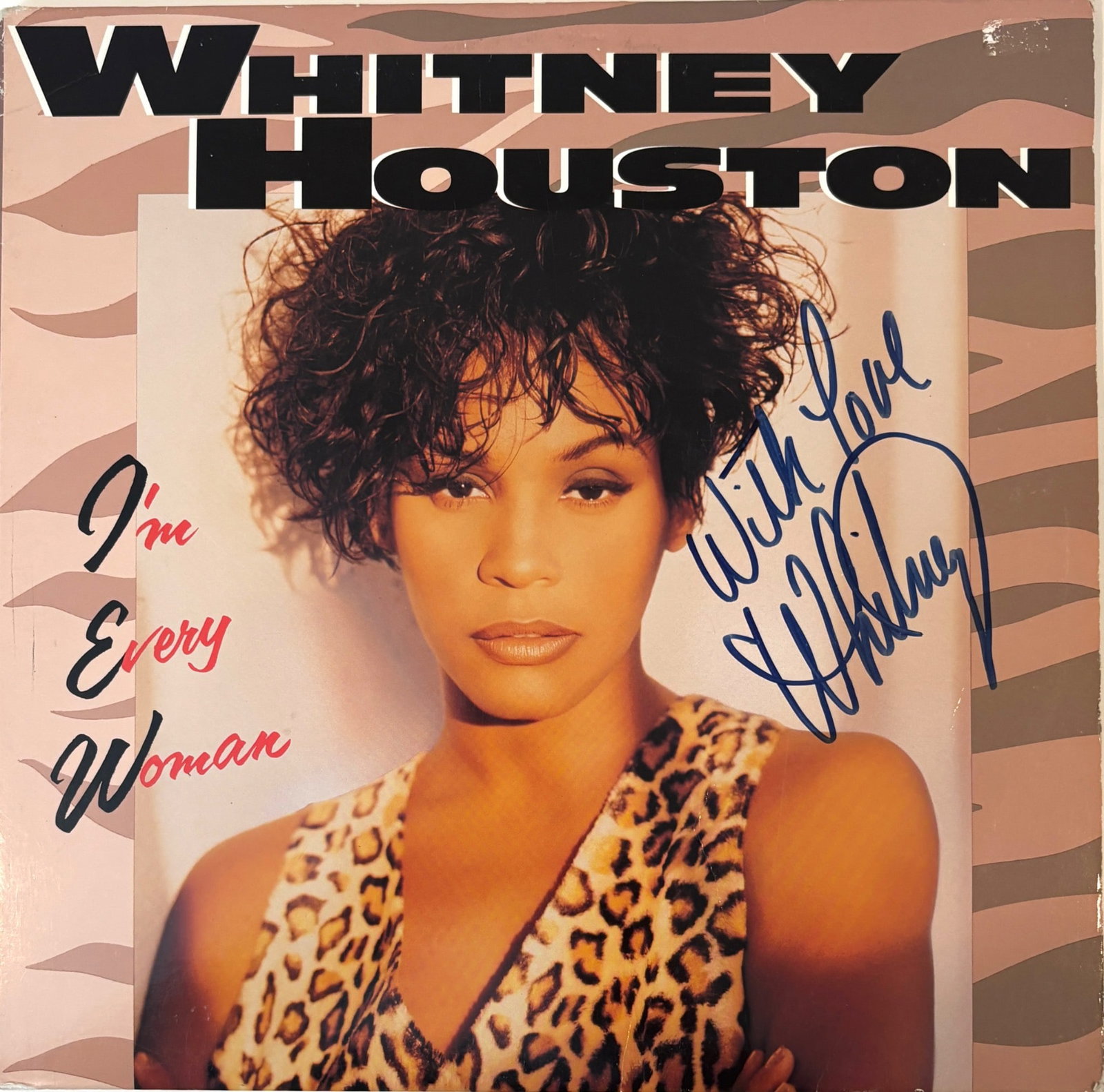 Whitney Houston Signed Im Every Woman Record with COA: Original vinyl record of Whitney Houstons Im Every Woman, featuring her autograph in blue marker on the front cover. Includes certification of authenticity from Quality Online Autographs and SAS, guar