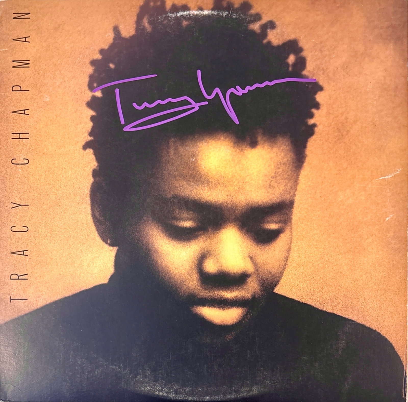 Tracy Chapman Self-Titled Signed Vinyl Record COA: Original vinyl record titled Tracy Chapman featuring tracks such as Fast Car and Talkin Bout a Revolution. Includes a front cover signed in purple by the artist, with a Certificate of Authenticity