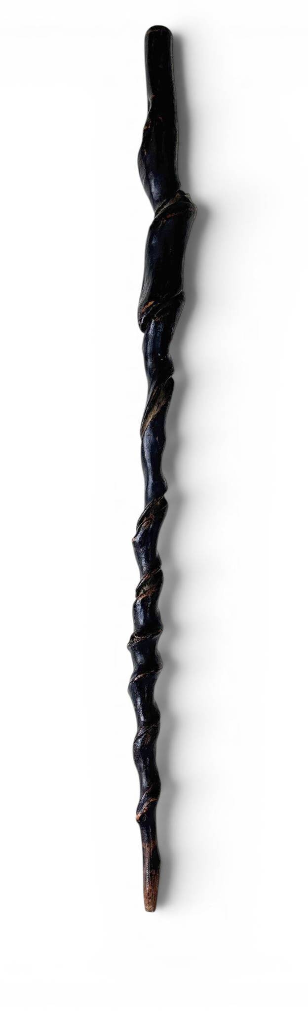 Hand-Carved Folk Art Spiral Walking Stick: A walking stick crafted from wood, featuring an intricate spiral carving along its length. The natural wood showcases a dark finish, accentuating the carved details. The base tapers slightly, designed