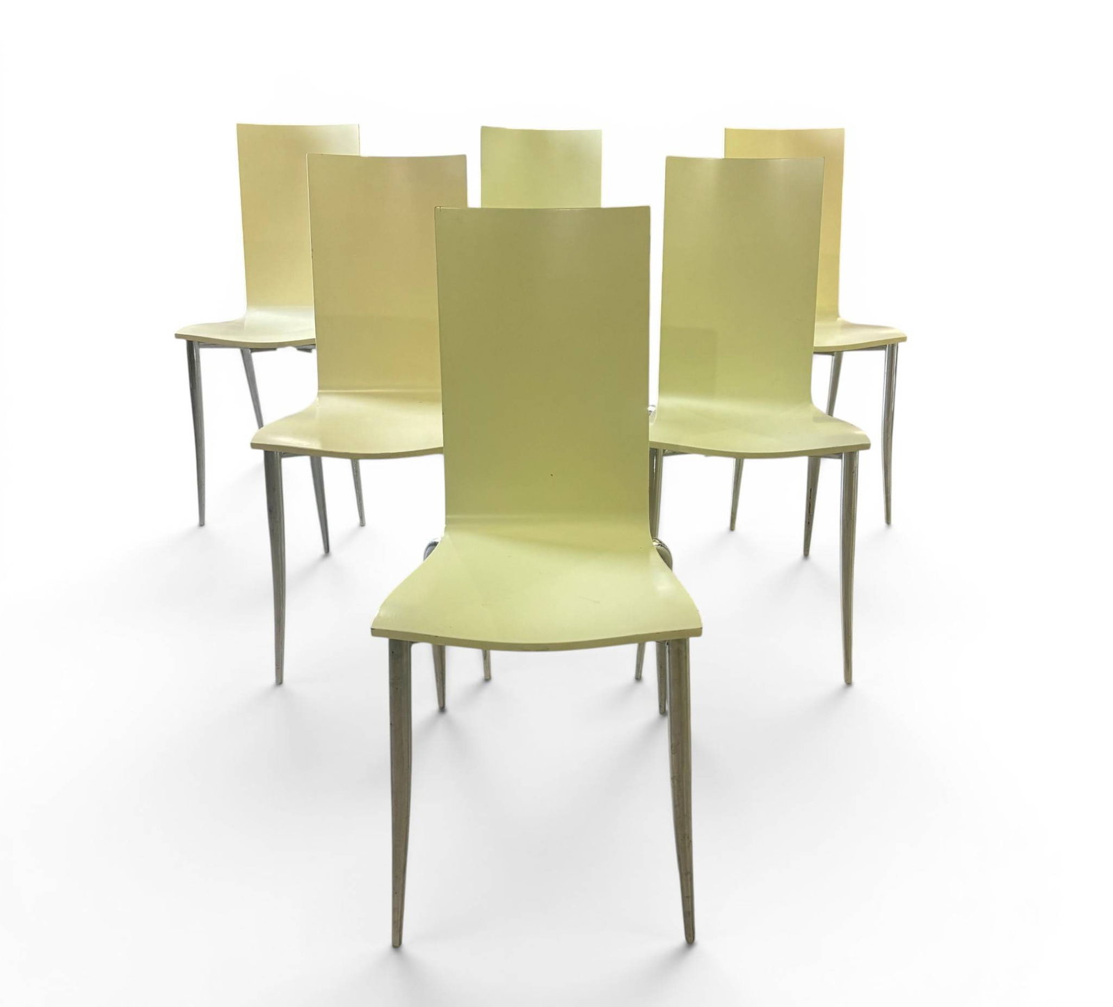 6 Philippe Starck Olly Tango Chairs for Aleph: Six Philippe Starck designed Tango chairs manufactured by Aleph, Made in Italy. Each chair features a molded yellow seat and backrest with polished metal legs in a sharp, angular design. Manufacturers