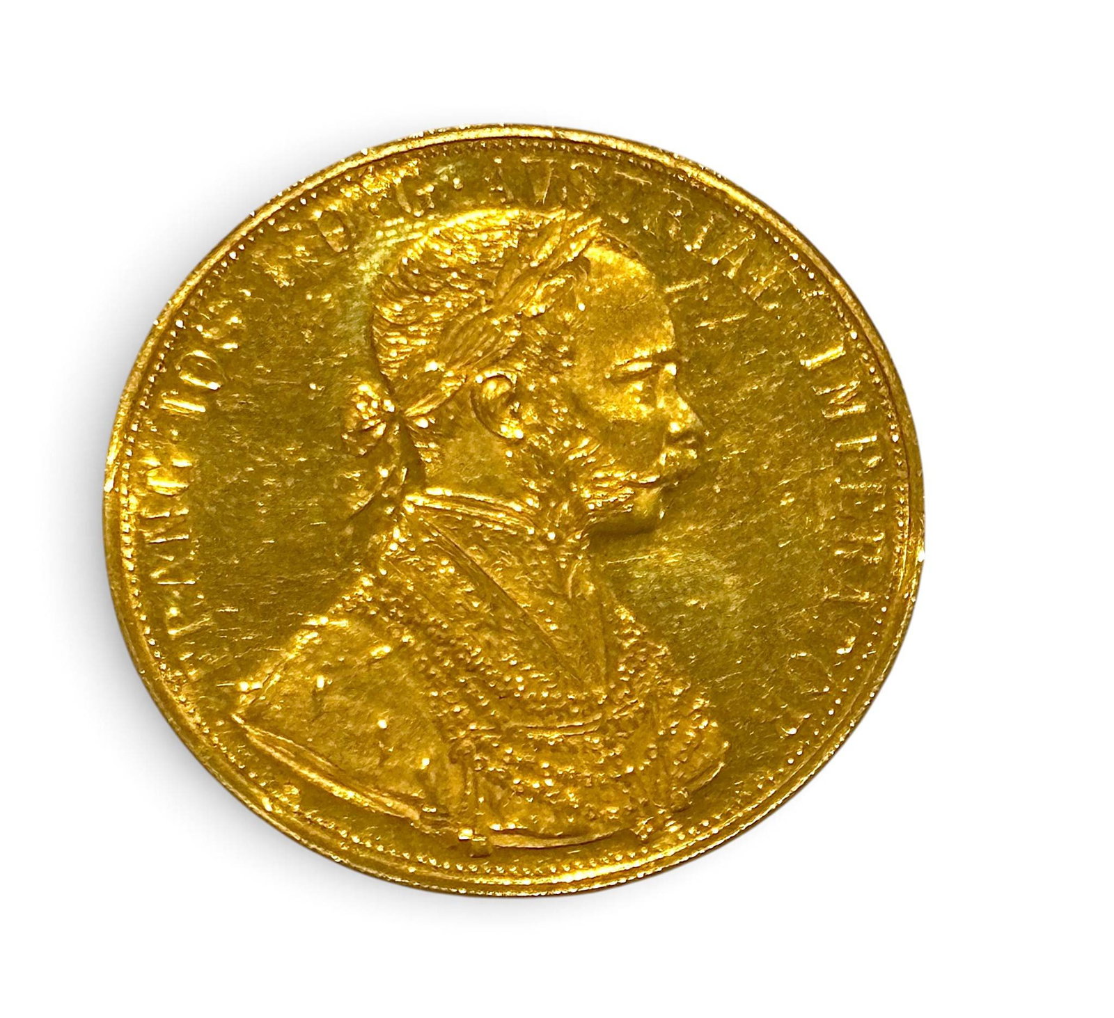 Austro-Hungarian Gold 4 Ducat Coin Featuring Franz Joseph I: A gold 4 ducat coin from the Austro-Hungarian Empire, dated late 19th century. Features a profile portrait of Emperor Franz Joseph I on the obverse, with the inscription ‘FRANC IOS I D G AVSTRIAE IM