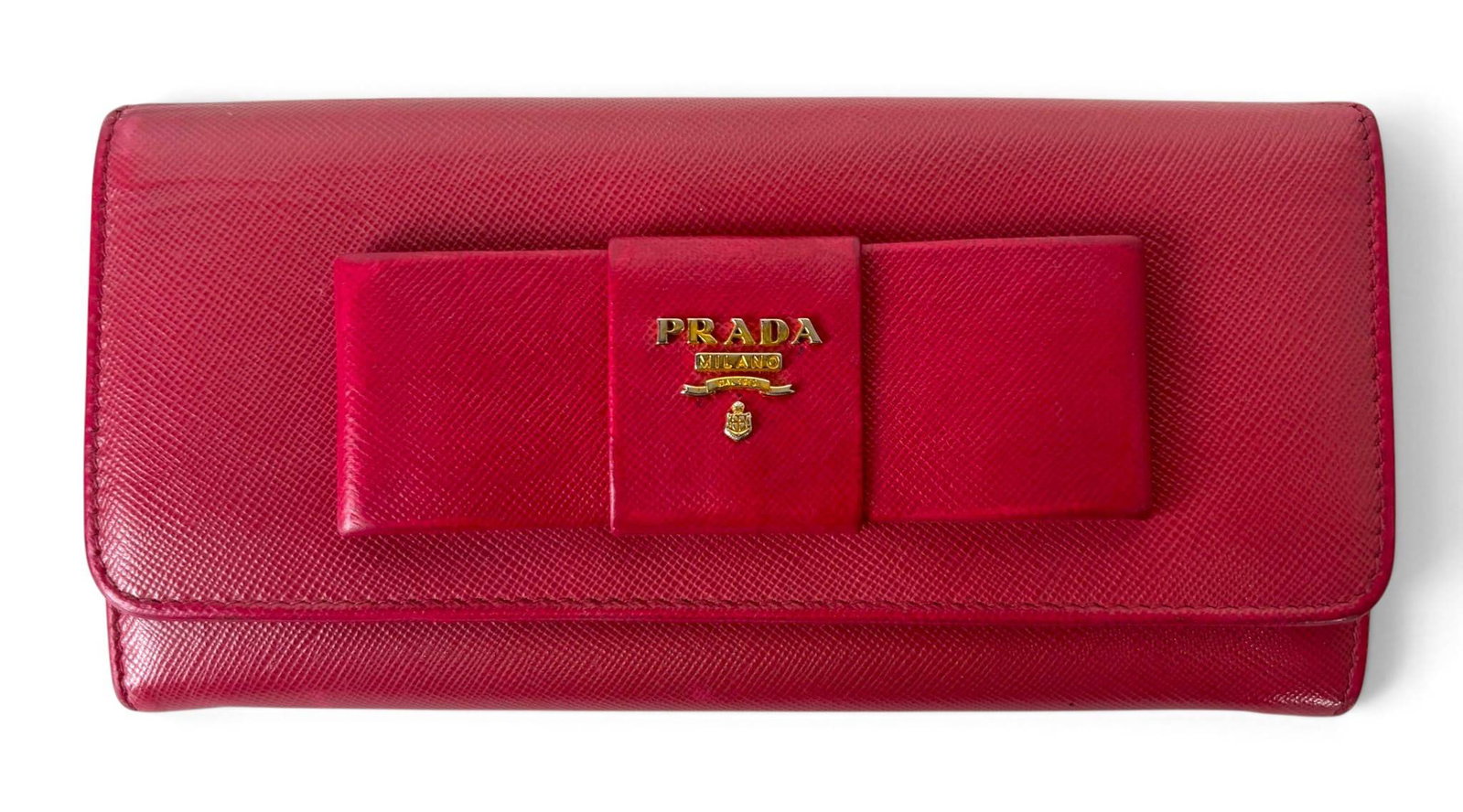 Prada Saffiano Fiocco Ribbon Bow Continental Wallet: Prada Saffiano Fiocco Ribbon Bow continental wallet crafted from red saffiano leather, featuring a front bow accent with a gold-tone Prada logo plaque. The interior includes multiple card slots, bill