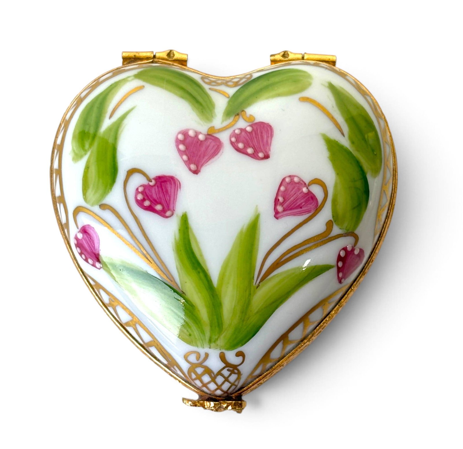 Limoges France Bleeding Heart Trinket Box: Heart-shaped Limoges porcelain trnket box featuring hand-painted pink bleeding heart flowers and green foliage, accented with gold latticework. The interior includes a matching floral design, and the 