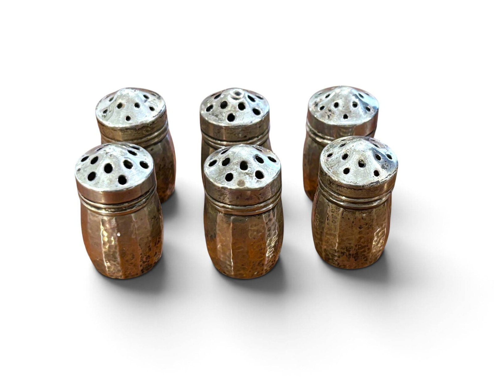 6 Hammered Sterling Silver Salt and Pepper Shakers: Six hammered sterling silver salt and pepper shakers marked with the A.S. and Co. maker’s mark and Sterling on the base. Each shaker features a faceted body design and a perforated, screw-top lid. T