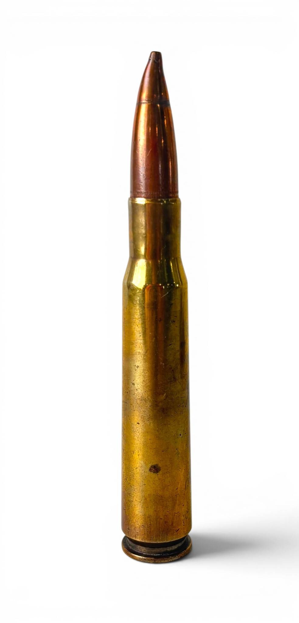 Large Brass and Copper Full-Metal Jacket Rifle Cartridge: A brass rifle cartridge with visible full metal jacket bullet, featuring a copper tip. The base is marked with T W 5 and U S M. Appears intact with some surface wear and tarnishing consistent with