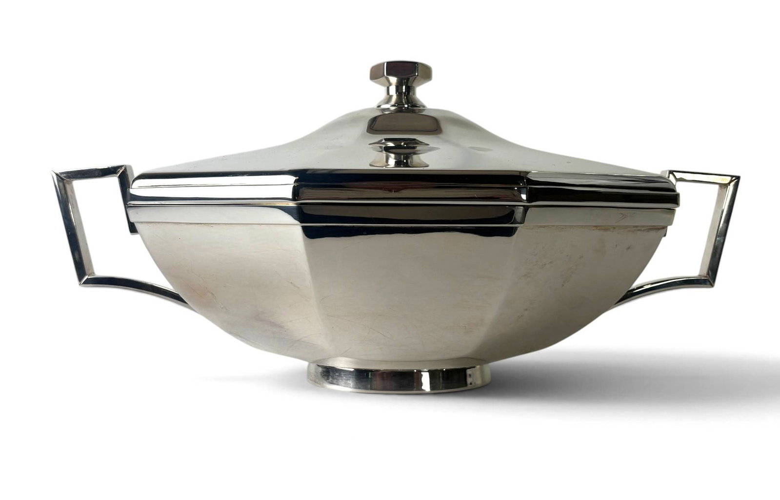 St. James of Brazil Silver Plate Covered Serving Dish: Silver-plated covered serving dish by St. James of Brazil. Features a geometric octagonal design with a domed lid, a faceted finial, and angular square handles. The base is stamped with the St. James