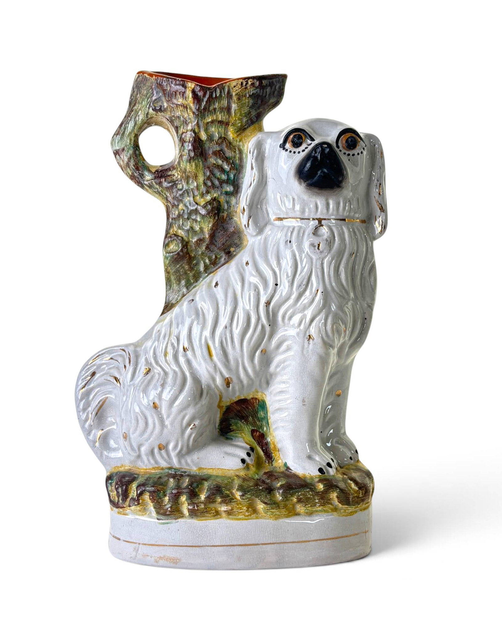 Staffordshire Ceramic Dog Spill Vase: White ceramic spill vase styled as a seated dog with detailed fur and painted features, including black eyes and nose. The vase has a tree trunk-shaped opening with a hole at the top. The base feature
