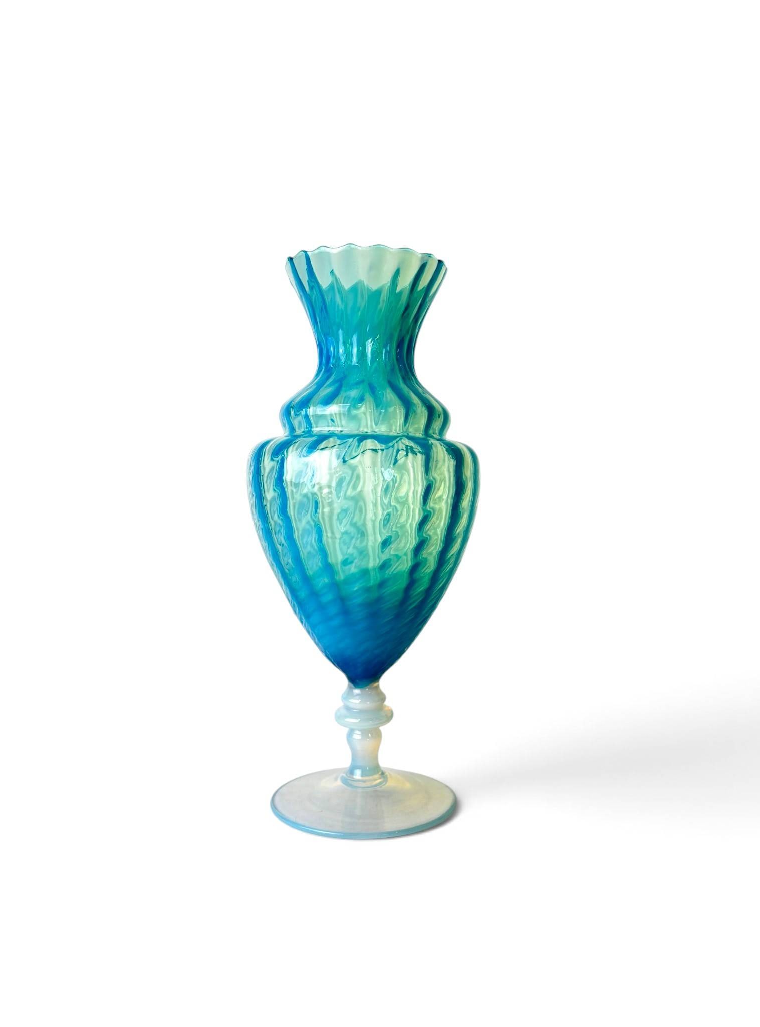 Italian Empoli Art Glass Footed Pedestal Vase: Italian Empoli art glass vase featuring a footed pedestal design with a prominent scalloped rim. Crafted in layered blue and green glass with swirl patterns throughout, creating a striking visual