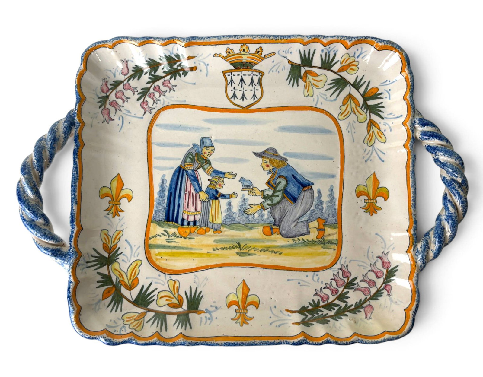 Henriot Quimper Petit Footed Bonnete, 1920s: Henriot Quimper footed bonnete dish crafted in the early 1920s, featuring hand-painted Breton figures and floral motifs in traditional polychromatic style. Rectangular with scalloped edges and blue-br