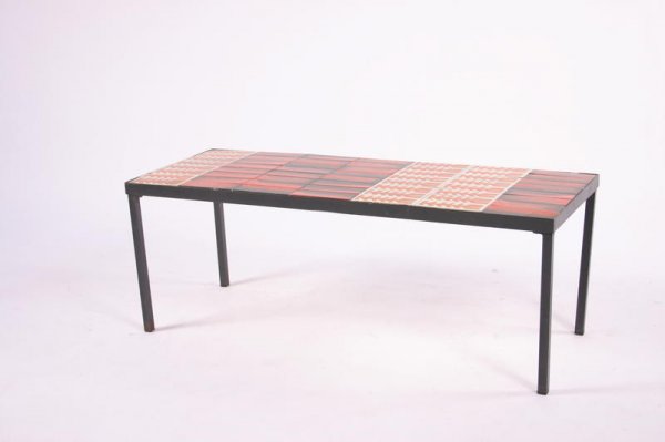 Roger Capron Coffee table, France, c. 1940-1950: 15.5h x 41w x 15.5d inches, black enameled iron base, orange glazed ceramic tiles
