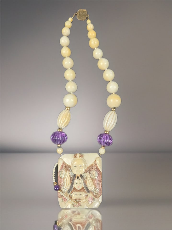 Bone Necklace with Happy Family With Cream and Purple Beads: 14k GF on clasp.We are not experts on Asian Jewelry.