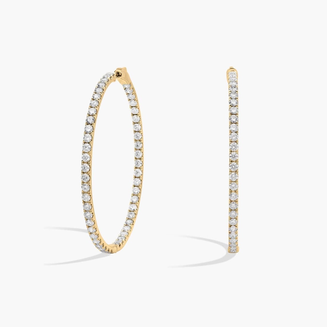 INSIDE OUT ROUND HOOPS, 2 INCH DIAMETER IN 14K YELLOW GOLD: INSIDE OUT ROUND HOOPS, 2 INCH DIAMETER IN 14K YELLOW GOLDDescription:An elevated twist on a timeless piece, these 14k yellow gold diamond hoop earrings showcase 7 ct. tw. of French pavé-set round
