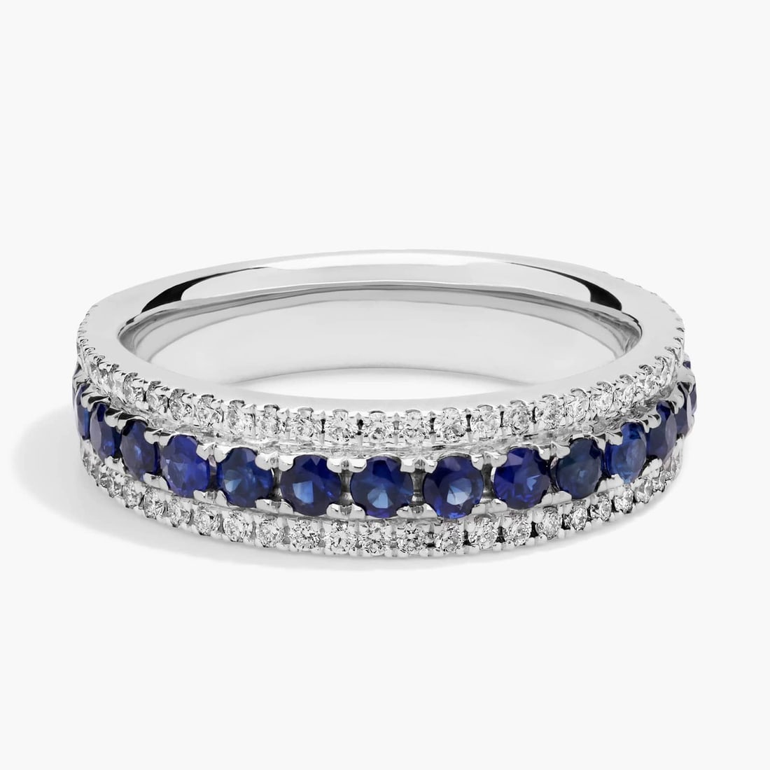 TRIPLE ROW SAPPHIRE AND DIAMOND RING IN 14K WHITE GOLD (1/3 CT. TW.): TRIPLE ROW SAPPHIRE AND DIAMOND RING IN 14K WHITE GOLD (1/3 CT. TW.)Description:A trail of velvety-blue sapphires, set between two rows of brilliant pavé diamonds, makes this 14k white gold band a