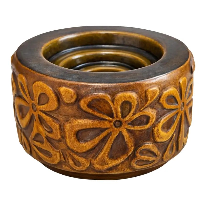 MID-CENTURY MODERN CERAMIC VESSEL WITH RELIEF FLORAL DECORATION: MID-CENTURY MODERN CERAMIC VESSEL WITH RELIEF FLORAL DECORATIONDescription:The vessel is constructed in a compact cylindrical form with a slightly recessed interior opening, suggesting potential use