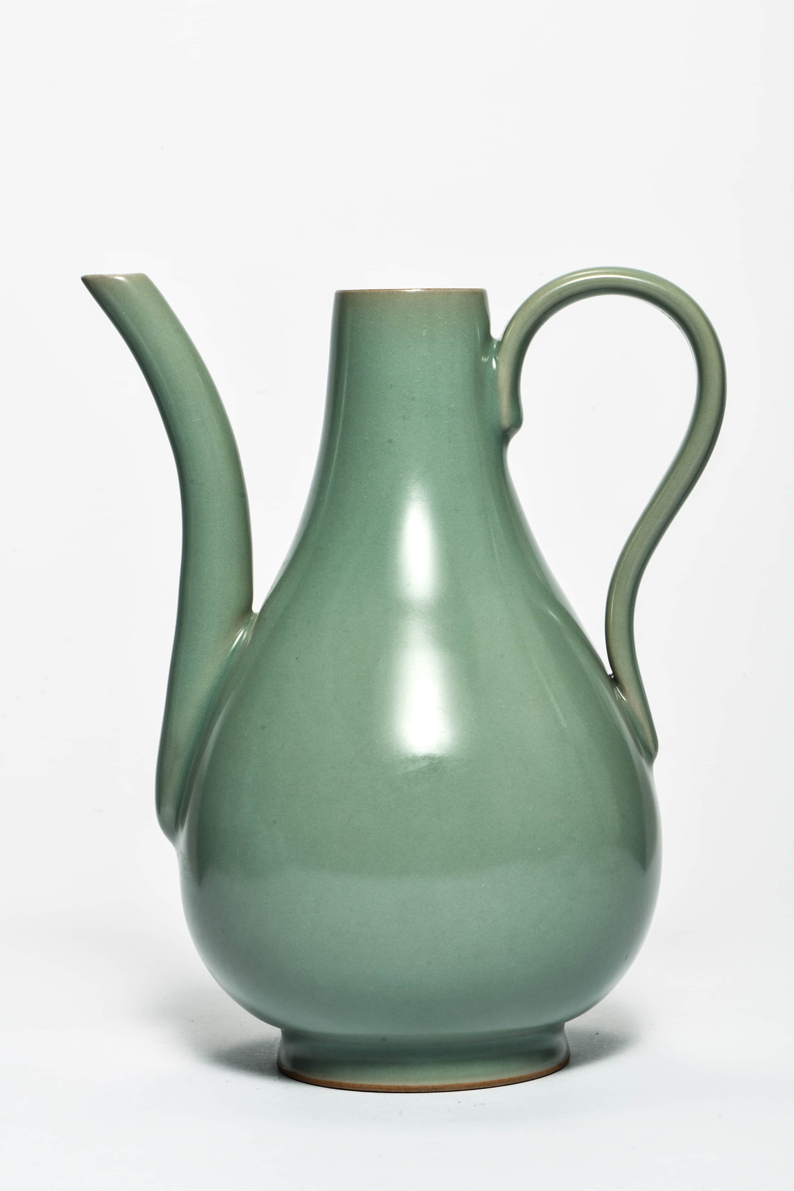 A CELADON-GLAZED EWER: A CELADON-GLAZED EWER Description: Length: 17cm Width: 17cm Height: 21cm