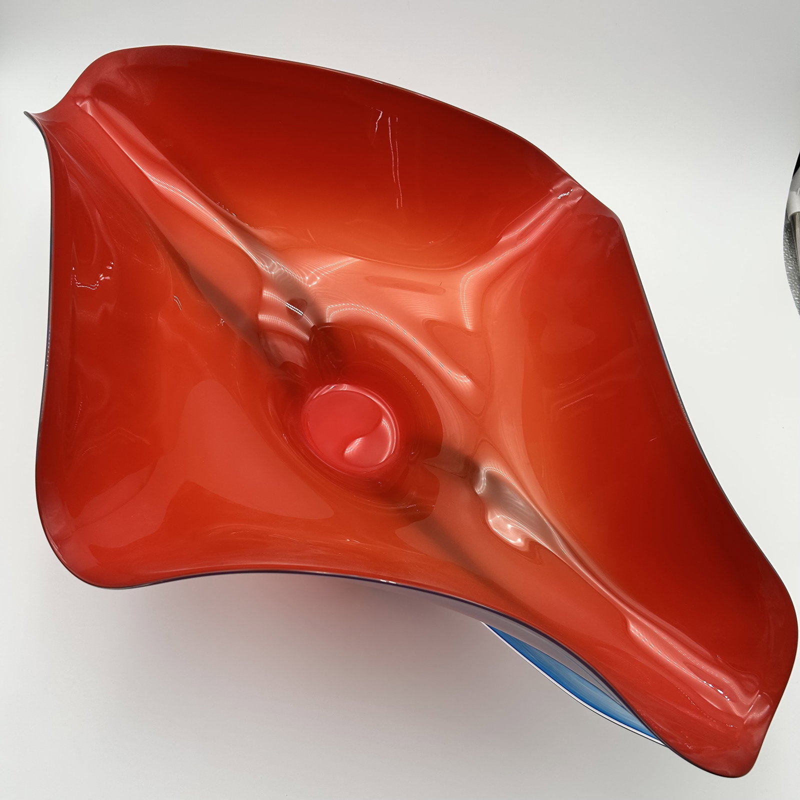 Tropical Bowl - Sunset Blown Glass by Branson, Signed: Large red bowl by artist Ed Branson, with sculped legs in blue wich run up the side of the bowl. Signed "2009 Branson". Blown Glass Ed Branson was born in 1957 in Greensboro, North Carolina. He has a 