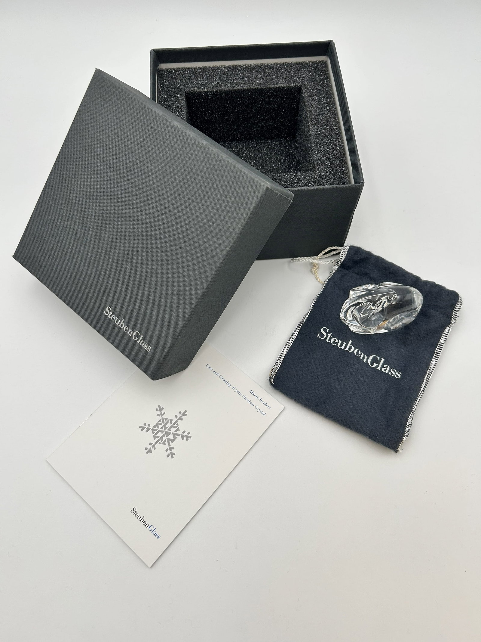 Vintage Steuben Glass - Ram, Signed: This Steuben Glass Ram is signed and comes with the the original box and Steuben drawstring bag. This ram was released in 1980.