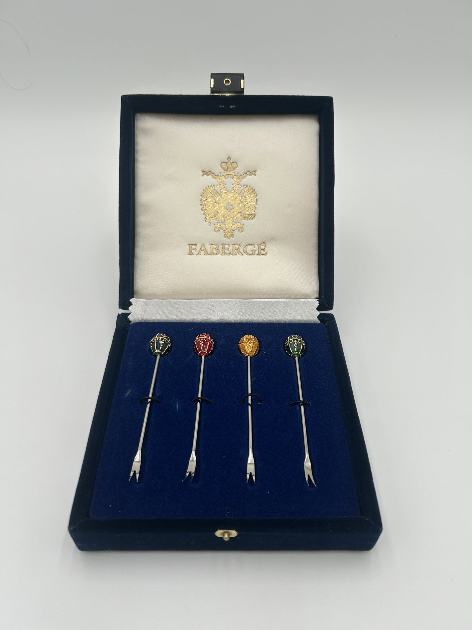 Faberge Enamel Imperial Egg Top Cocktail Forks - Set #2: Faberge Enamel Imperial Egg Top Cocktail Forks Set of 4 in Original Velvet Box - Set #2 In original presentation box.