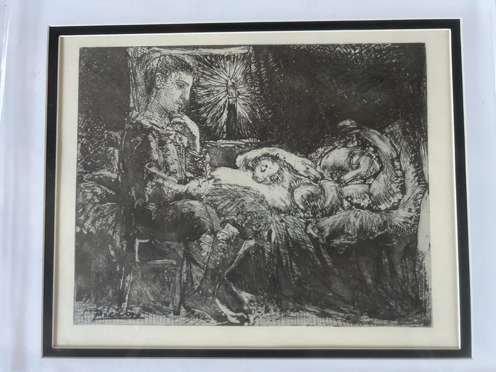 "Garcon Et Dormeuse A La Candelle" by Pablo Picasso: Pablo Picasso heliogravure in black and white.