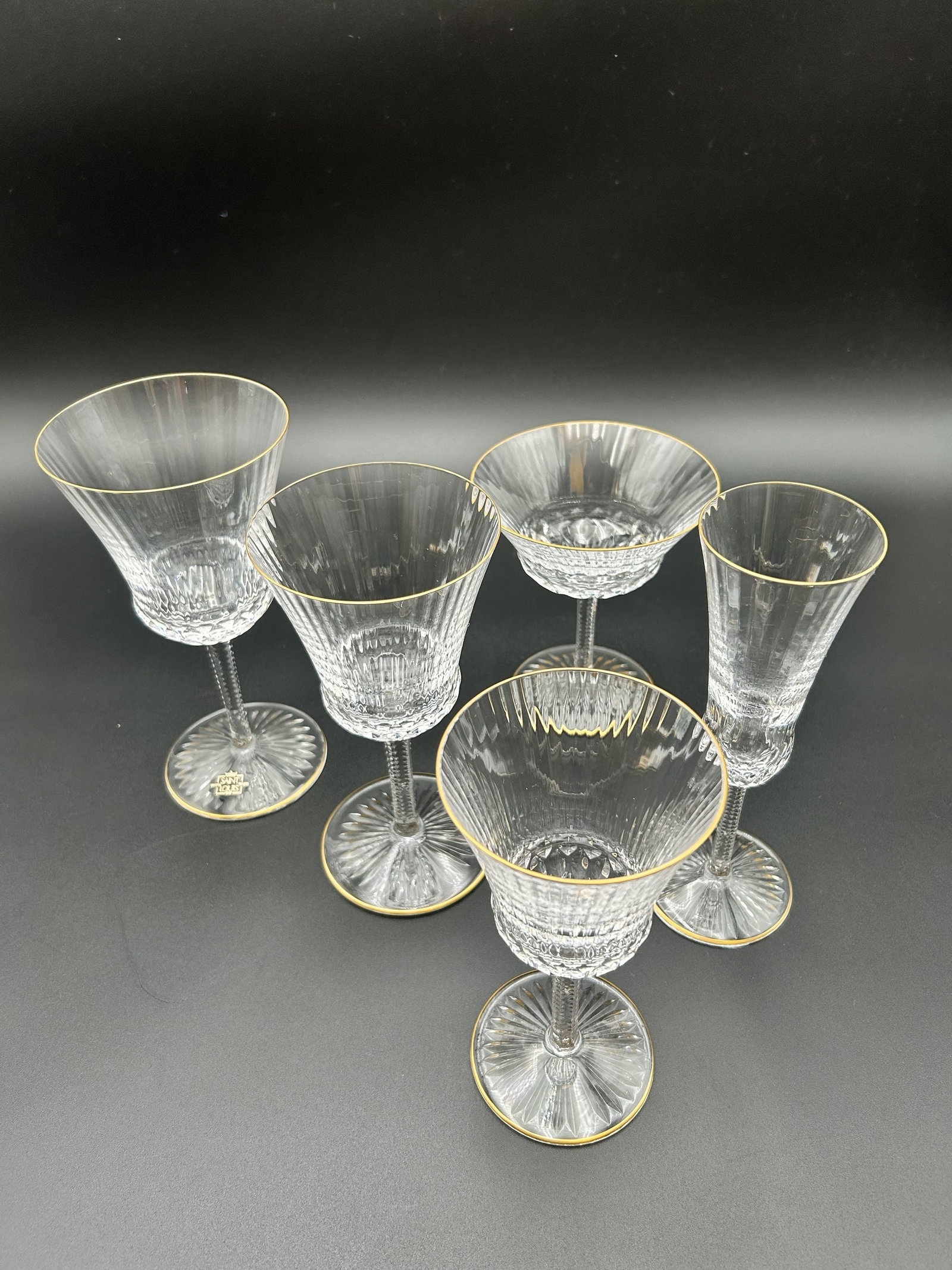 St. Louis Crystal Apollo Gold Set Times 6: St. Louis Crystal is made in France, and has a 24-carat gold rim. This is a lot of six (6) sets of St. Louis Crystal Apollo Gold glasses as depicted in the picture. One set is made up of: Burgundy Win