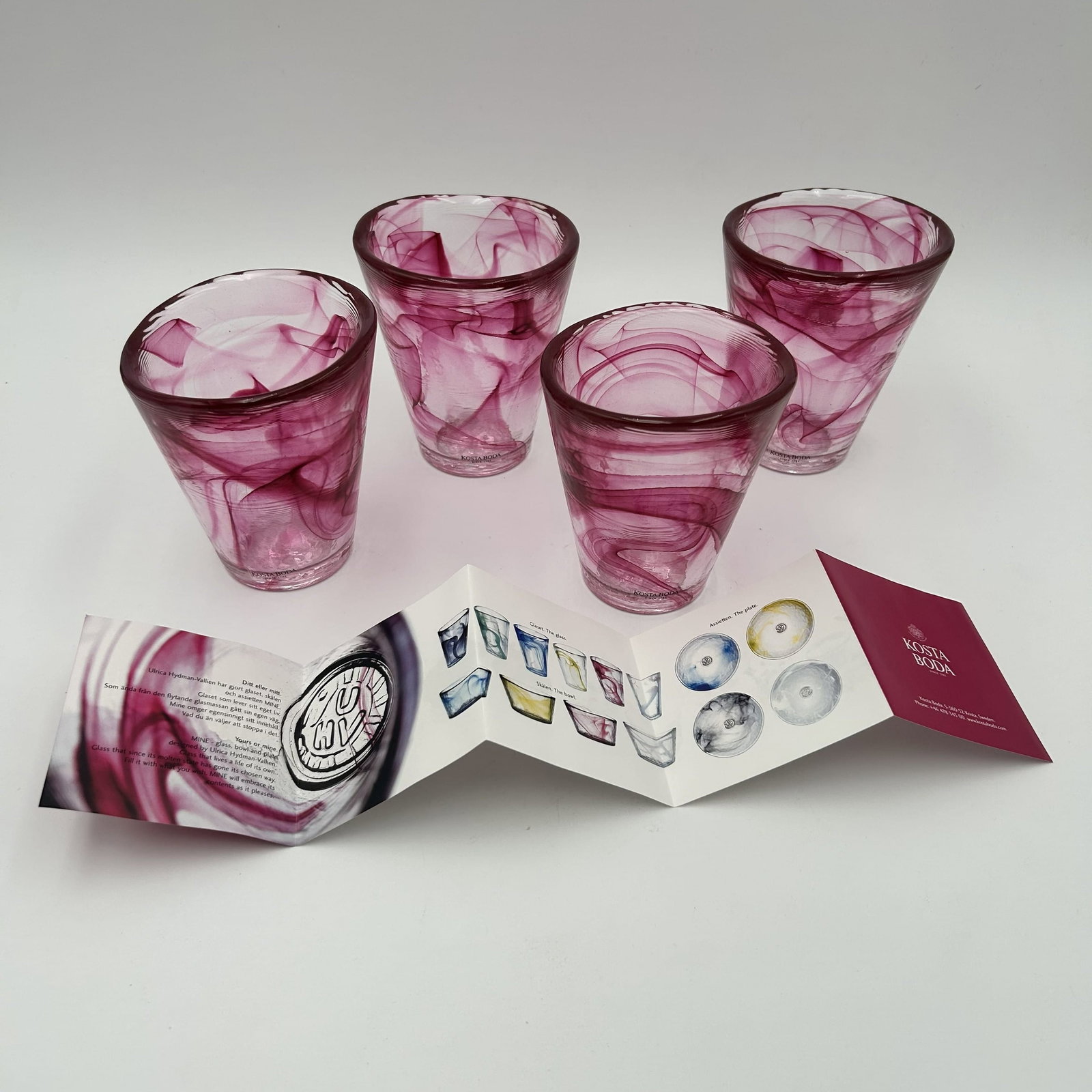 Four (4) Swedish Kosta Boda Red Swirl Drinking Glasses Ulrica Hydman: Set of four (4) brown vintage Kosta Boda swirl drinking glasses, designed by Ulrica Hydman Vallien, Sweden, 1980s. Each glass measures approximately 3.75 inches in diameter x approximately 4.25 inches