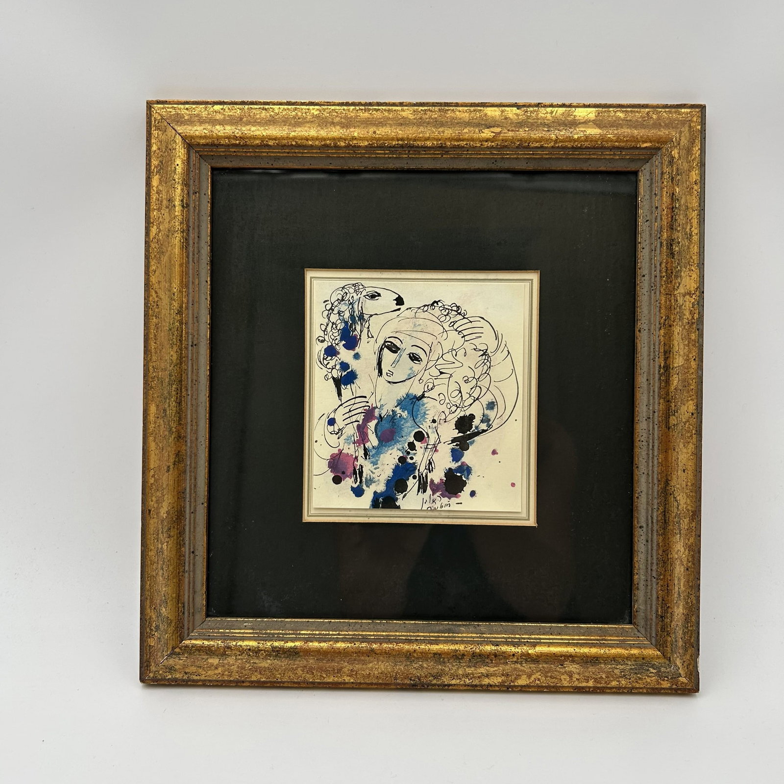 "Shepherd" by Reuven Rubin Colored Lithograph Signed: This is a framed colored lithograph called "Shepherd" by Israeli artist Reuven Rubin (1893 - 1974). The artwork is 4" W x 4.5" H With frame - 11" W x 11.5" H