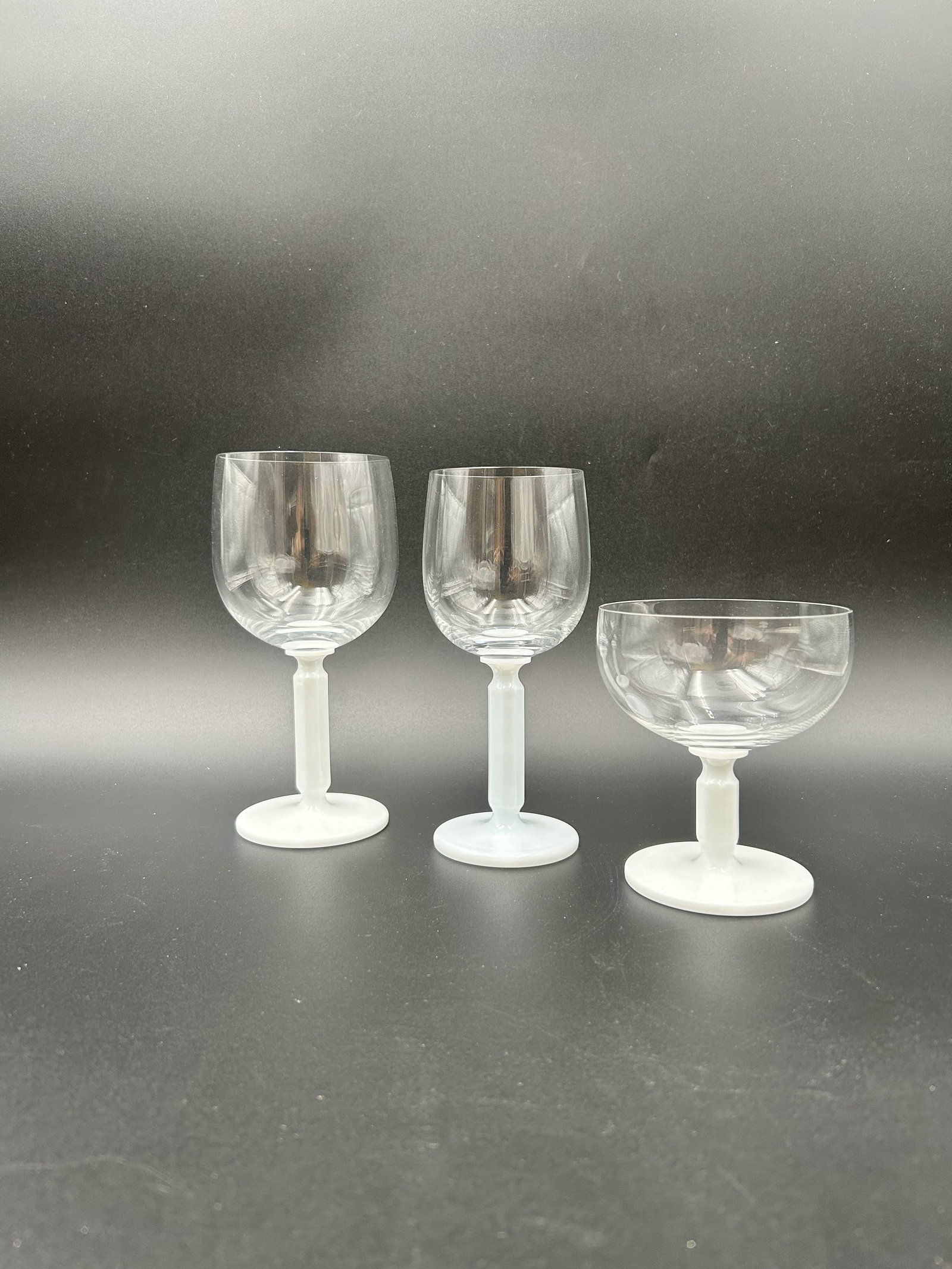 Eight (8) Sets of Rosenthal Studio Line Glasses: Eight (8) sets of Rosenthal Studio Line Glasses. Each set is comprised of the following three (3) glasses: - Red Wine or Water Goblet - 7" H - White Wine - 6 1/2" H - Champagne - 4 14/" H Mixed media 