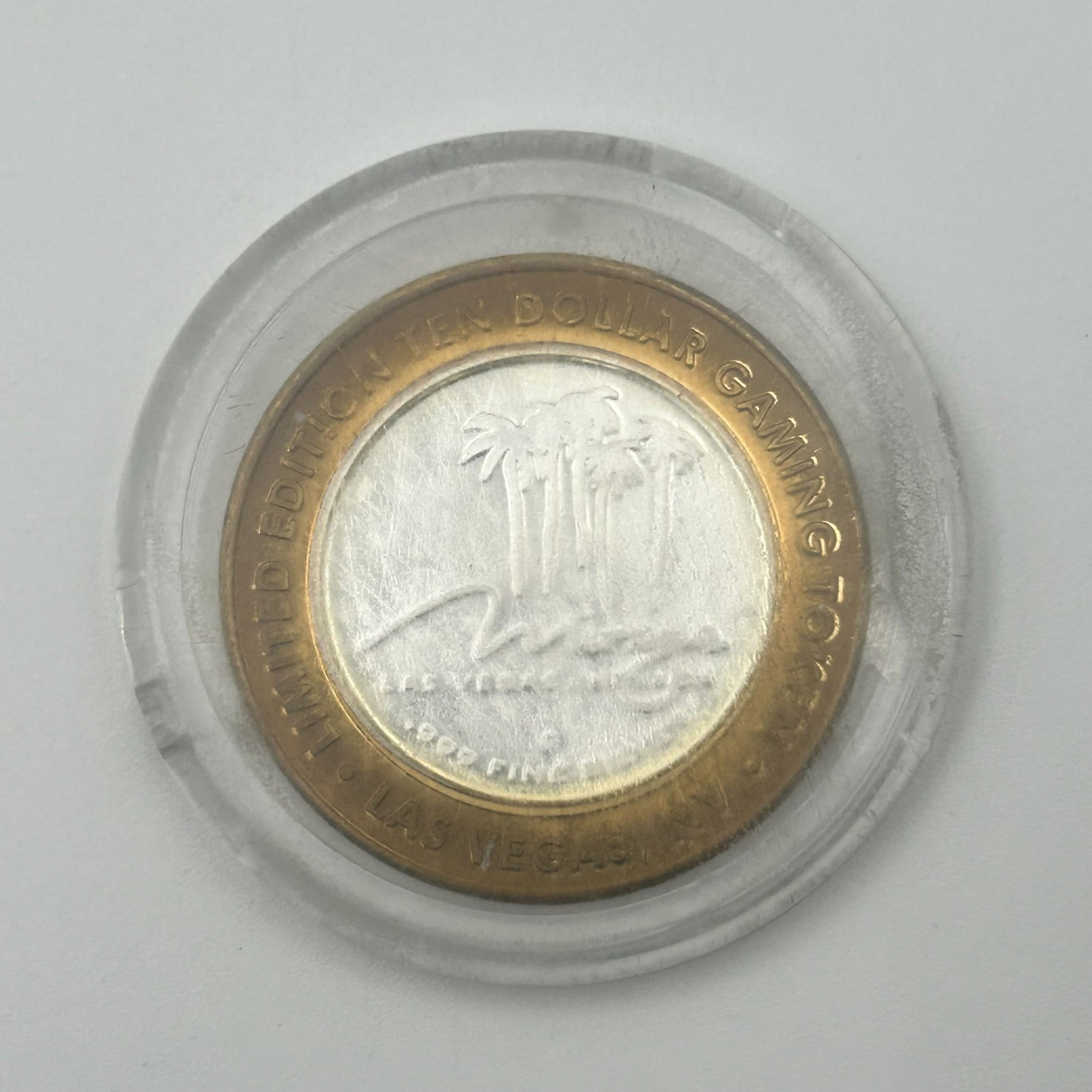 Mirage Las Vegas $10 Limited Edition Silver Strike: This listing is for a Mirage Las Vegas $10 Limited Edition Silver Strike Gaming Token Featuring Danny Gans. .999 Fine Silver Center with a Brass Outer Ring .66 Troy Ounces of Pure Silver 0926-C11