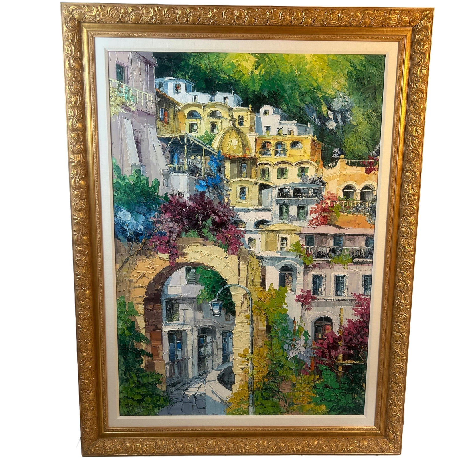 “Positano?? by Antonio DiViccaro Oil Painting Framed: Extra large, framed and matted oil on canvas “Positano” by Antonio DiViccaro. Note that the paint is slightly raised to bring out the vivid buildiings and flowers, making you feel like you are