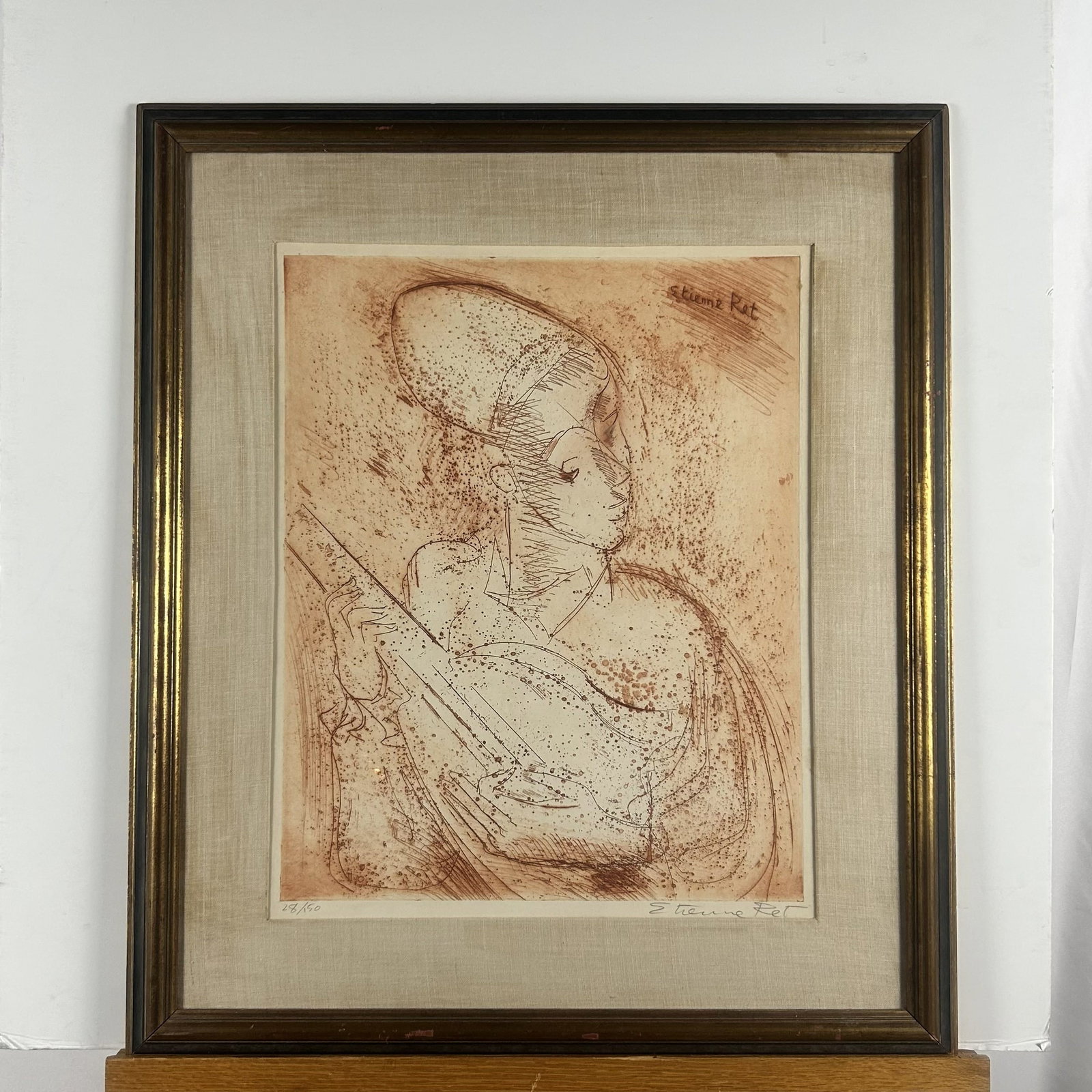 "La Musique" by Étienne Ret (1900–1996): This framed print is an original sepia-toned etching titled "La Musique" (or a companion musical study) by the French-American modernist artist Étienne Ret (1900–1996). It features delicate