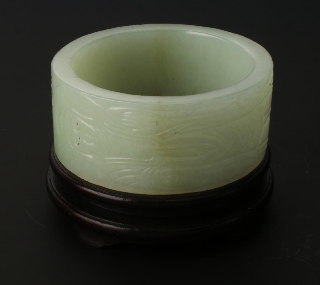 CIRCULAR JADE CARVING ON STAND (1 of 8)