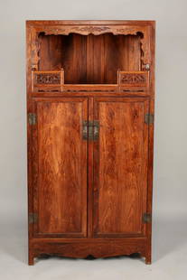 HUANG HUA LI ETAGERE: Huang Hua Li Etagere: A Huanghuali etagere with an open top shelf surrounded by carved and pierced fretwork. The bottom is closed by a pair of cabinet-book doors that open to reveal two drawers a