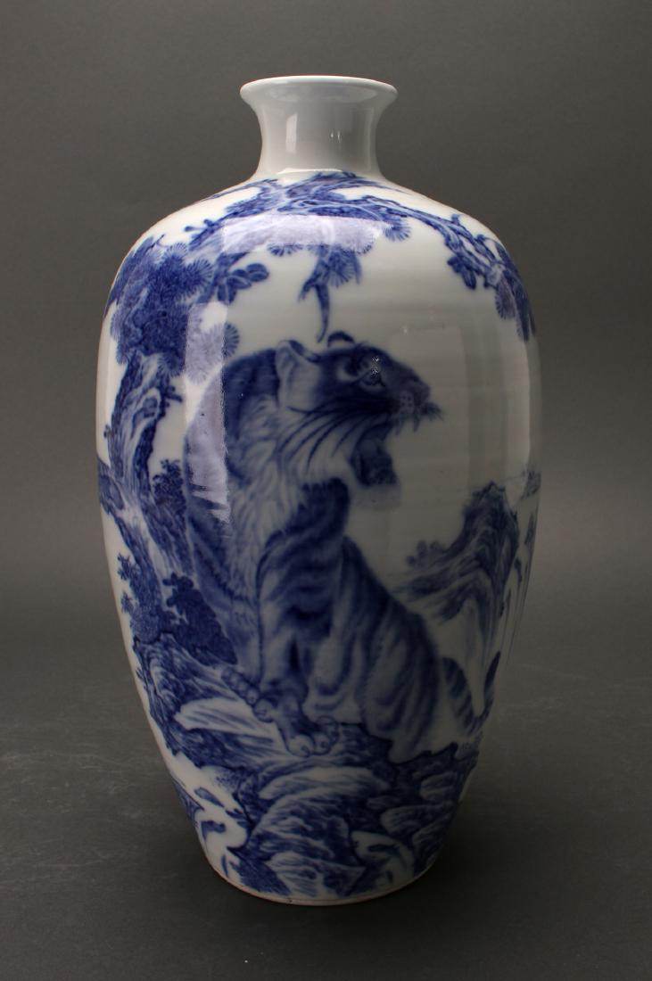 BLUE & WHITE VASE WITH TIGER WANG BU MARK: Blue & White Vase With Tiger Wang Bu Mark: Blue and white vase with a tiger roaring on a cliff under a pine tree. Mountains and waterfalls in the distance. Calligraphy on the reverse and marked o